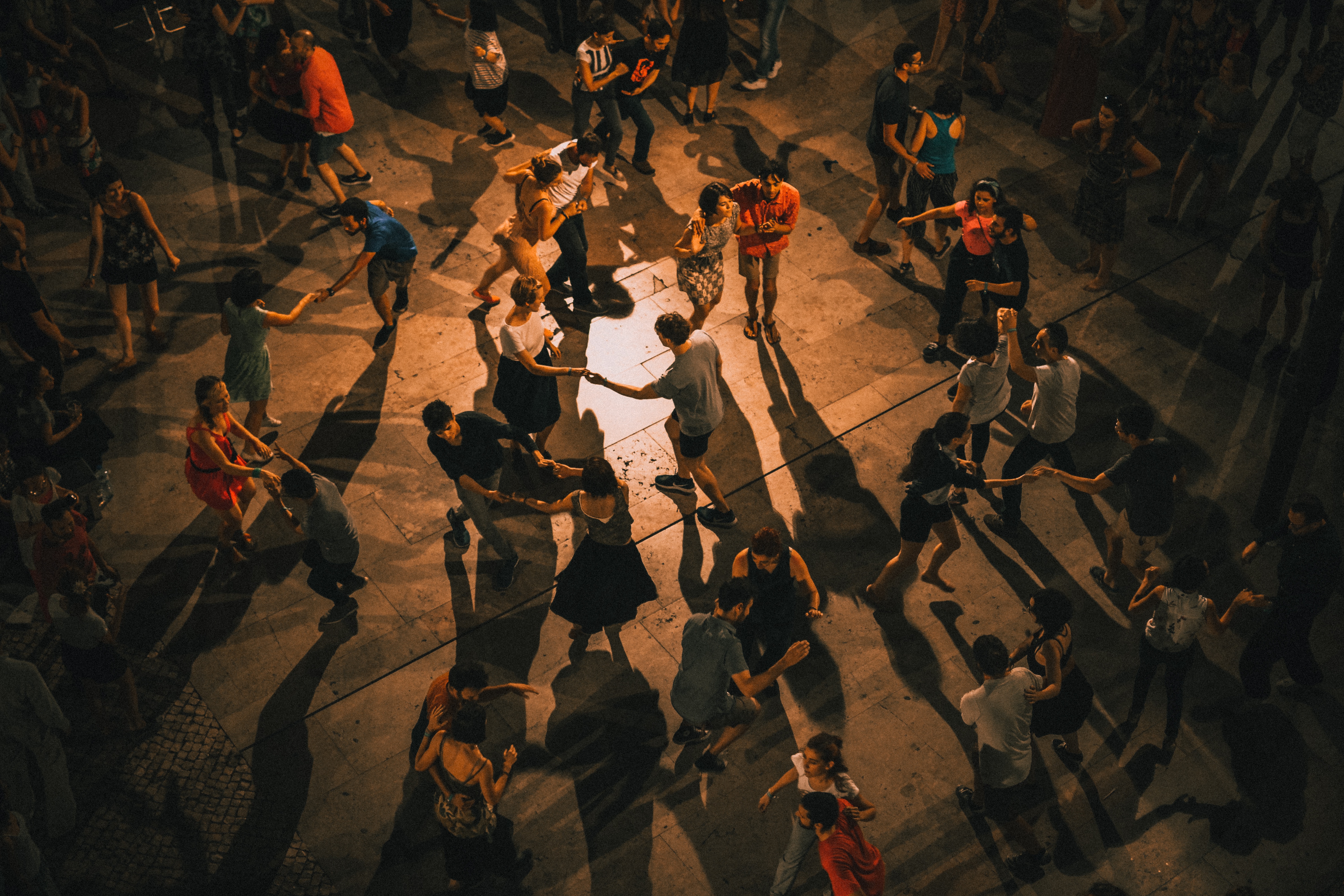 People dancing together at night